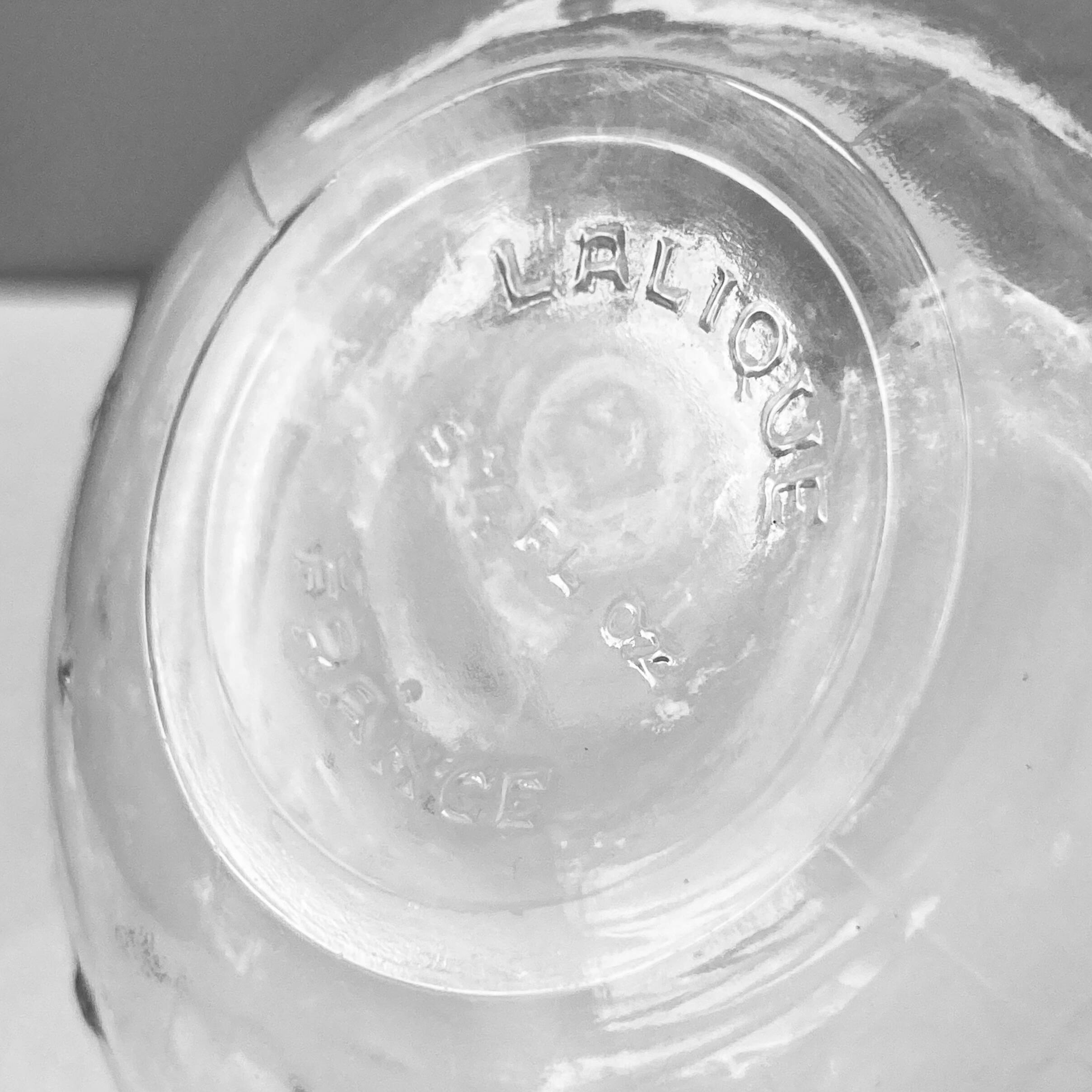 Lalique soliflore ball vase in colorless molded glass with light relief decoration of a seedling of stars