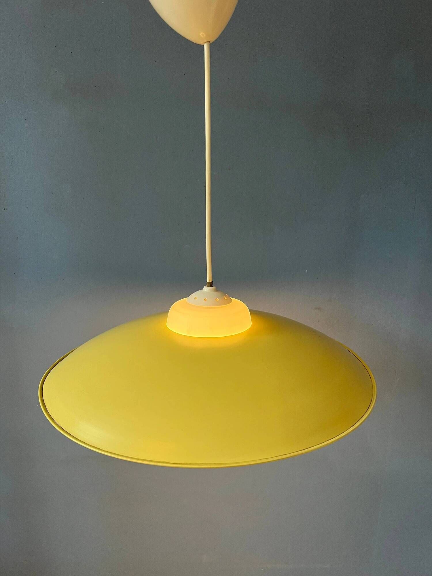 Danish mid-century suspension with opaline glass shade and yellow metal cover.