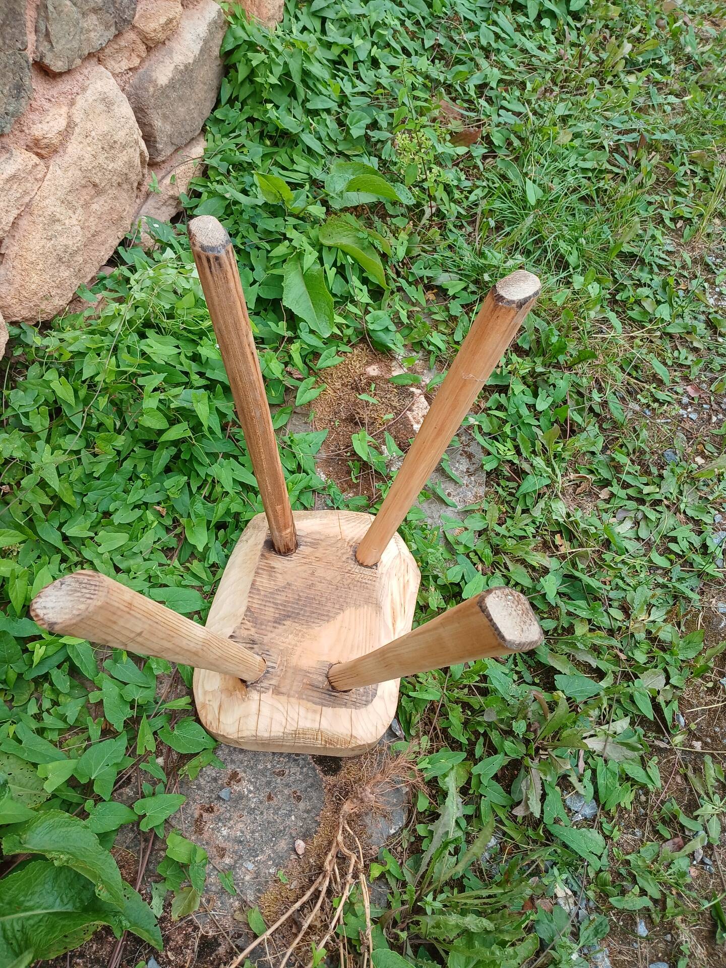 Antique stool in raw wood