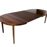 Dining table in rosewood with three extension plates, of danish design from the 1960s.