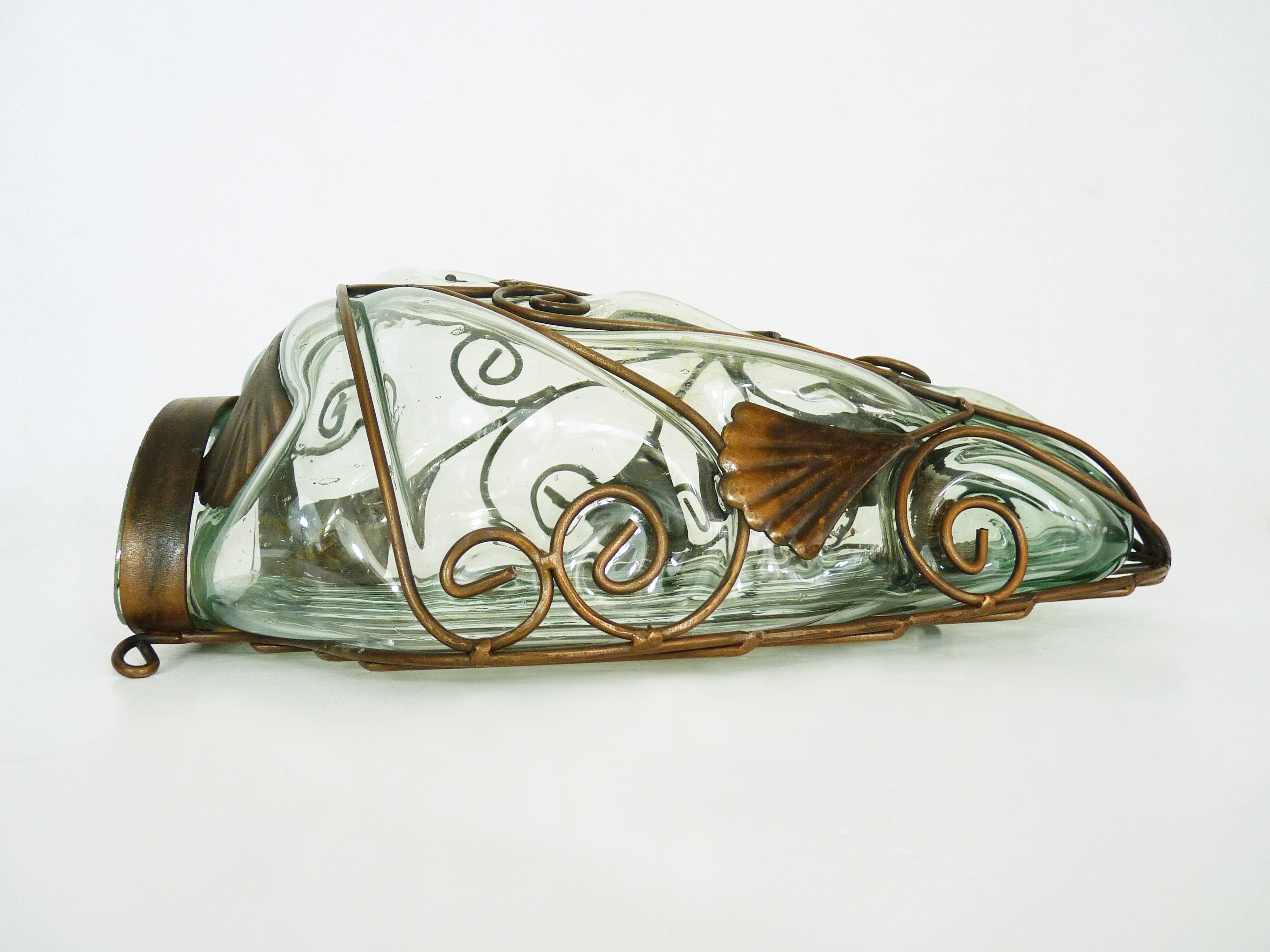 Pair of wall light cage in blown glass green color and wrought iron. Murano style. Year 80