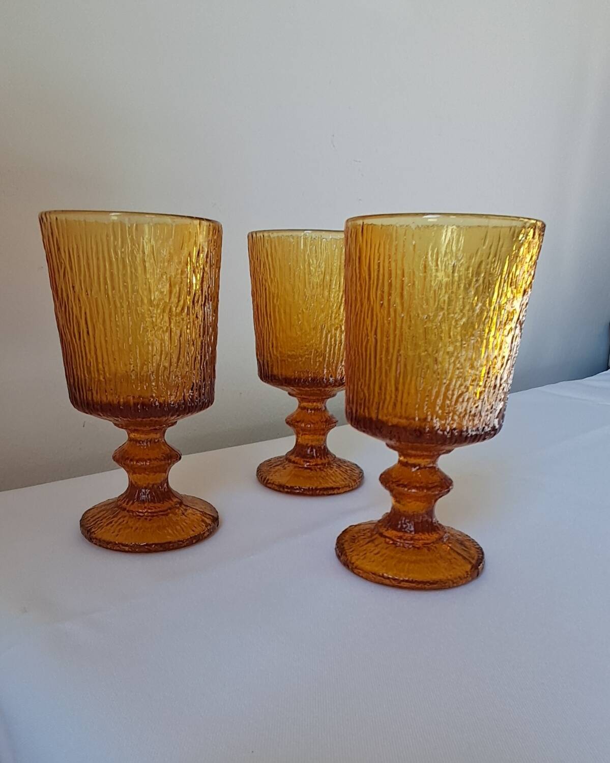 3 textured amber stemmed glasses. Vintage.