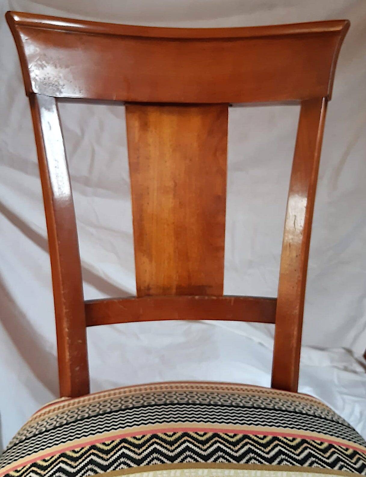 2 varnished solid wood chairs with "ethnic" padding