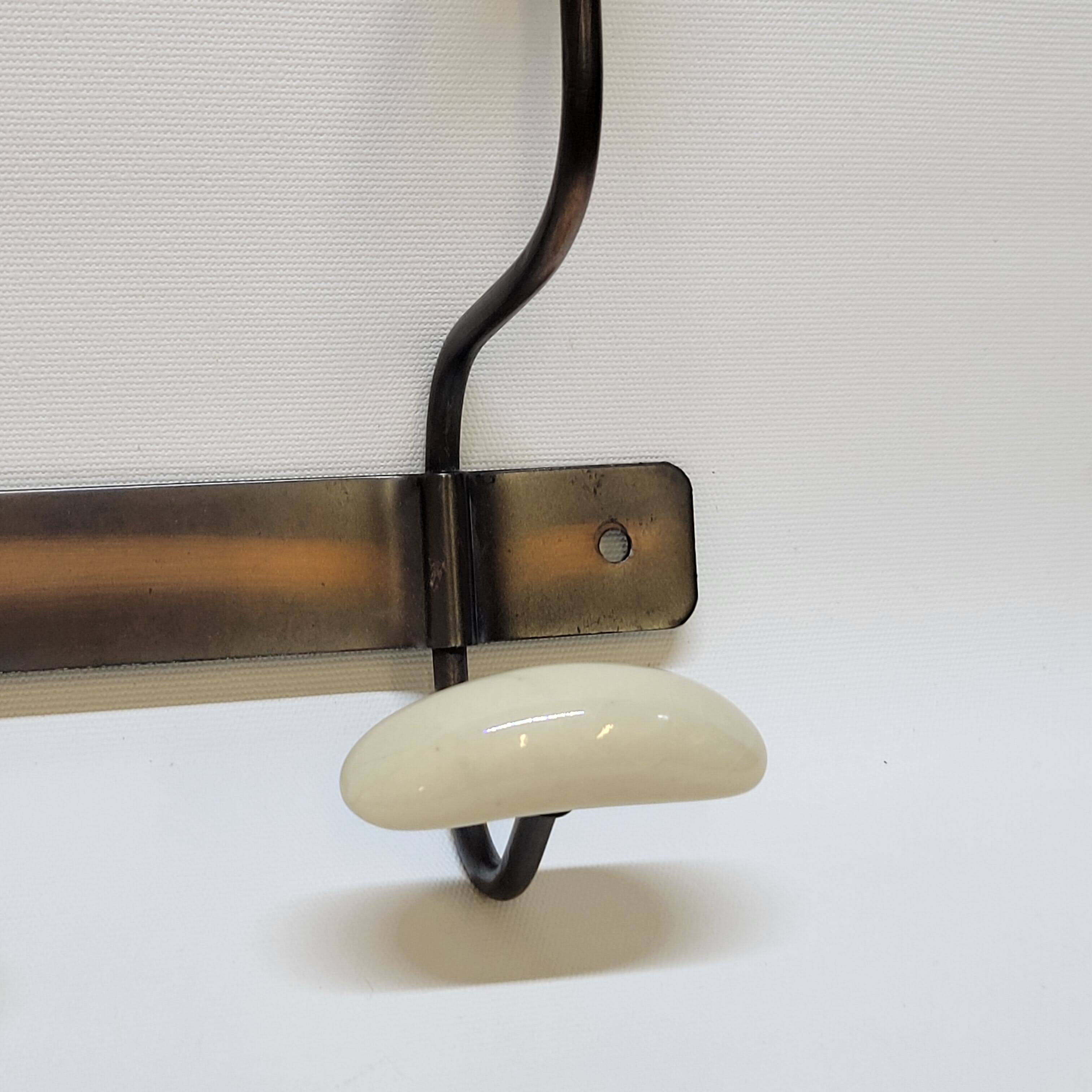 Wall coat rack in metal and porcelain with 2 hooks