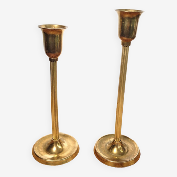Pair of asymmetrical brass candlesticks