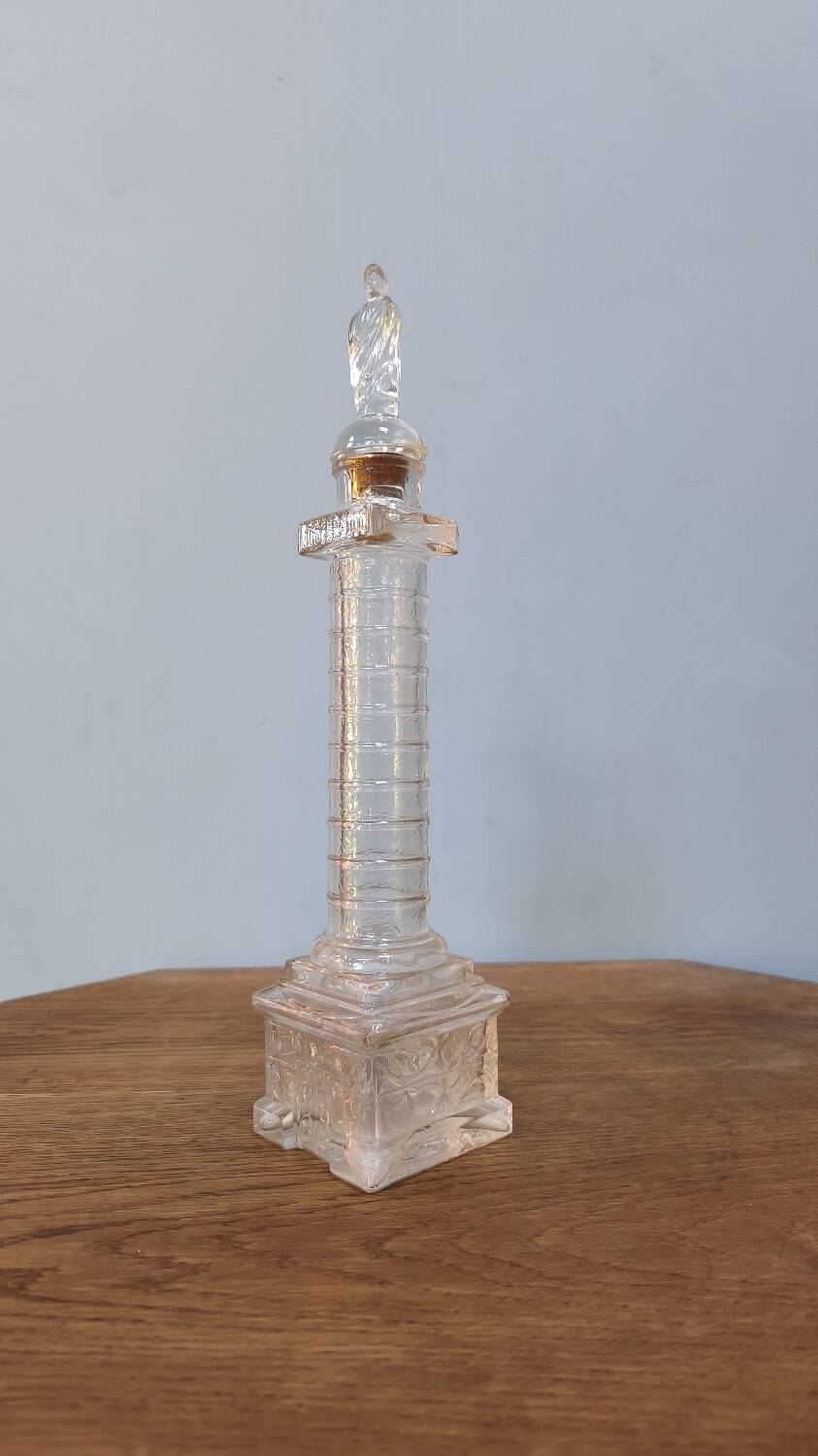 Vendôme column perfume bottle in moulded glass, 19th century.
