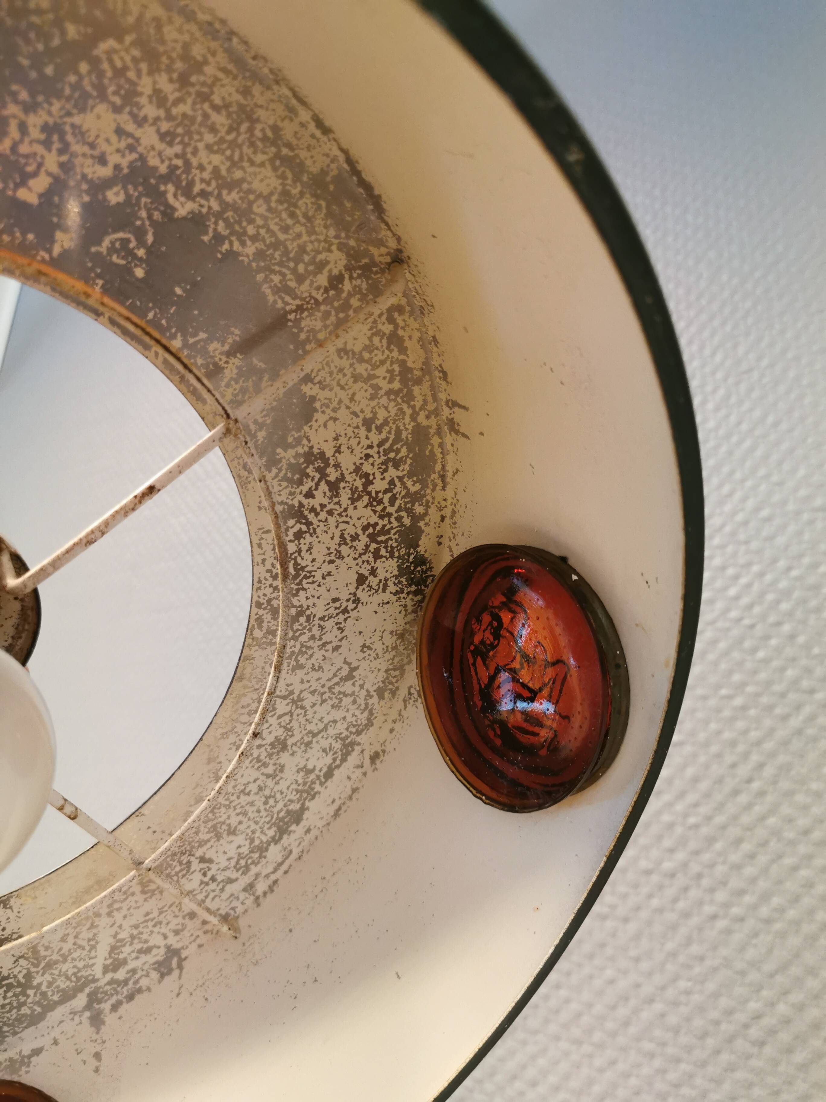 Swedish hanging lamp, in dark green lacquered metal with red glass prisms and brass top/suspension.