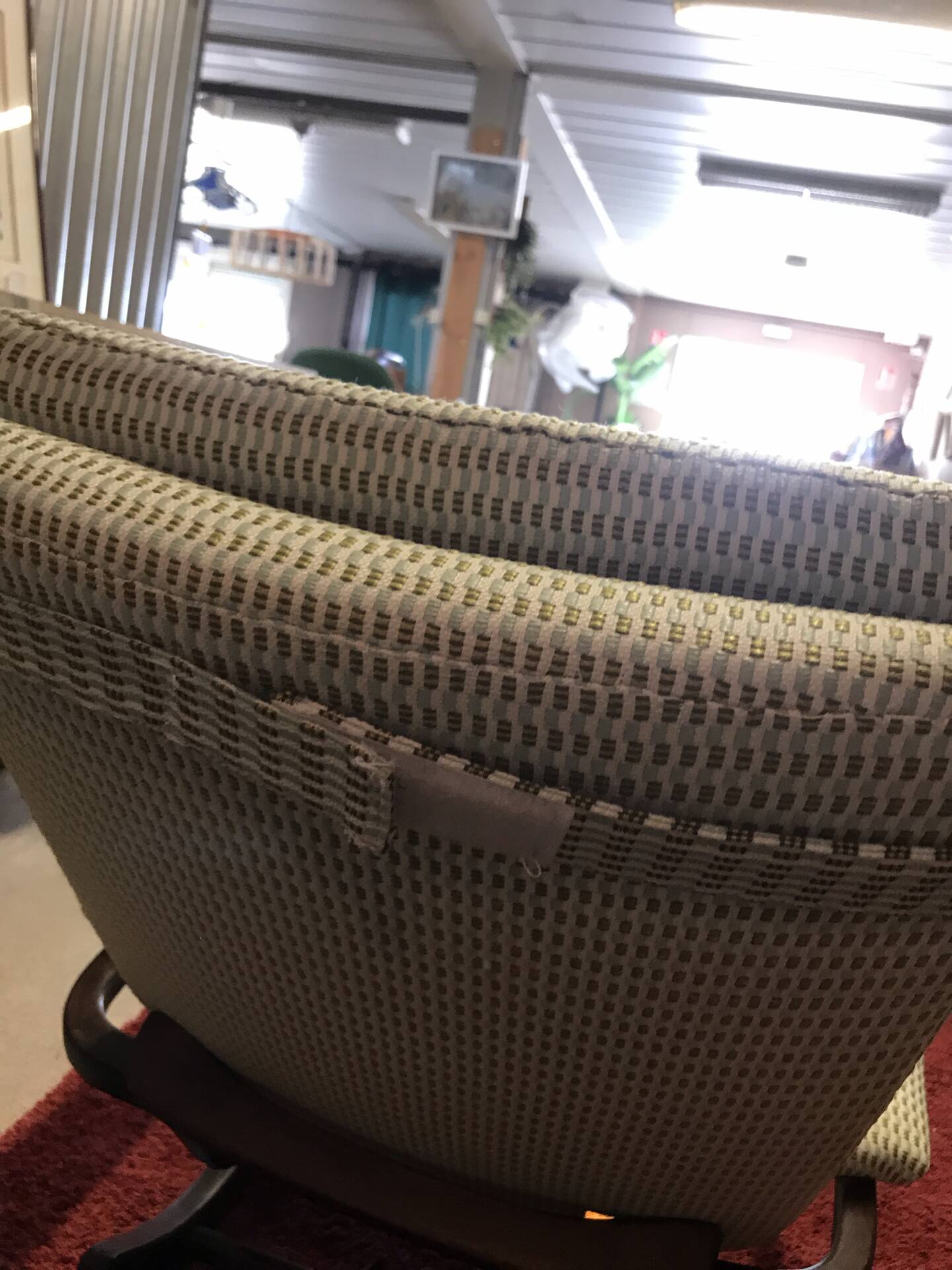 Rocking lounge chair made of fabric suitable for outdoor use.