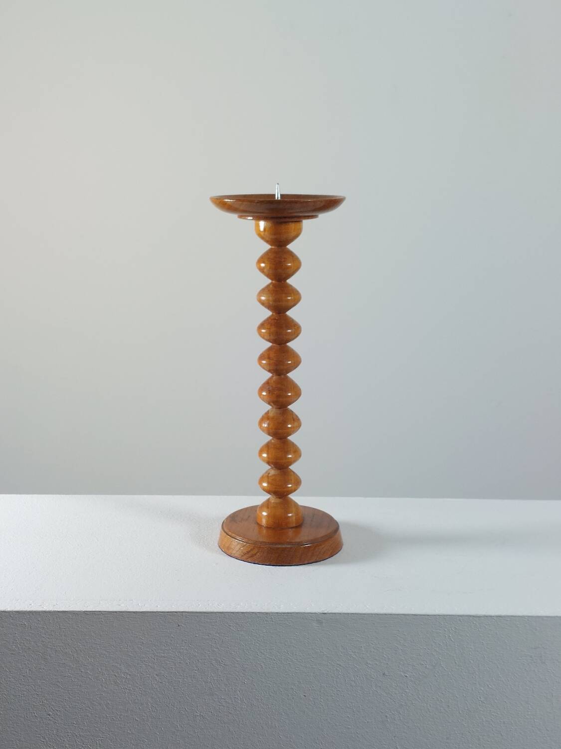 Vintage mid-century wooden candlestick, spool decoration from the 1970s.