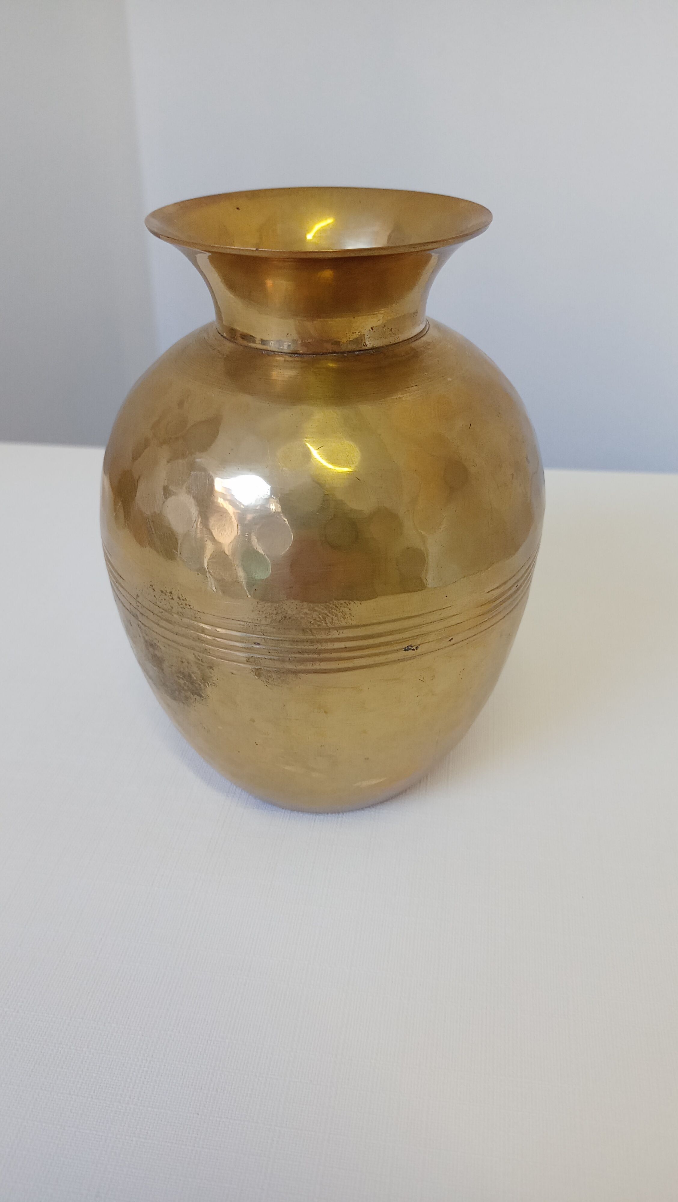 Hammered golden vase