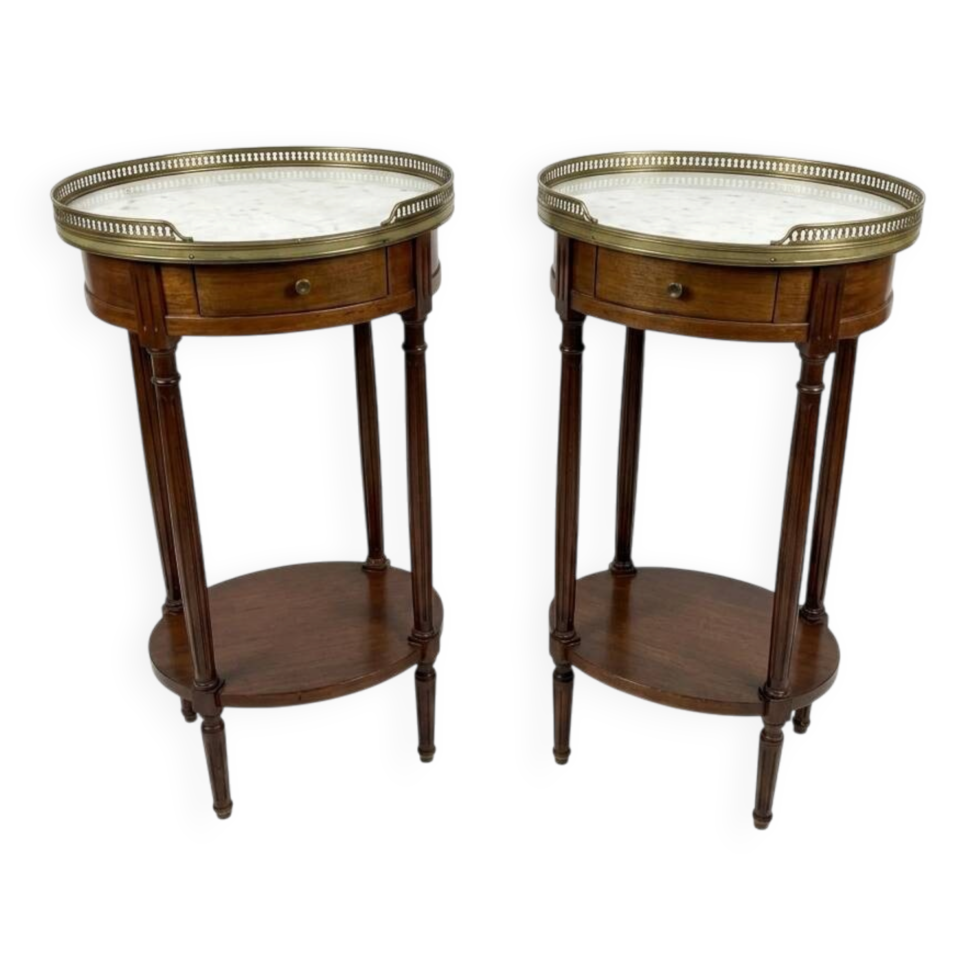 Pair of Louis XVI style bedside tables in mahogany, with marble tops.