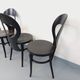 Set of 4 vintage Mouette chairs by Baumann in black wood from the 1960s.