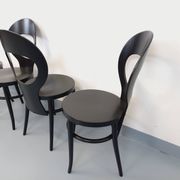 Set of 4 vintage Mouette chairs by Baumann in black wood from the 1960s.