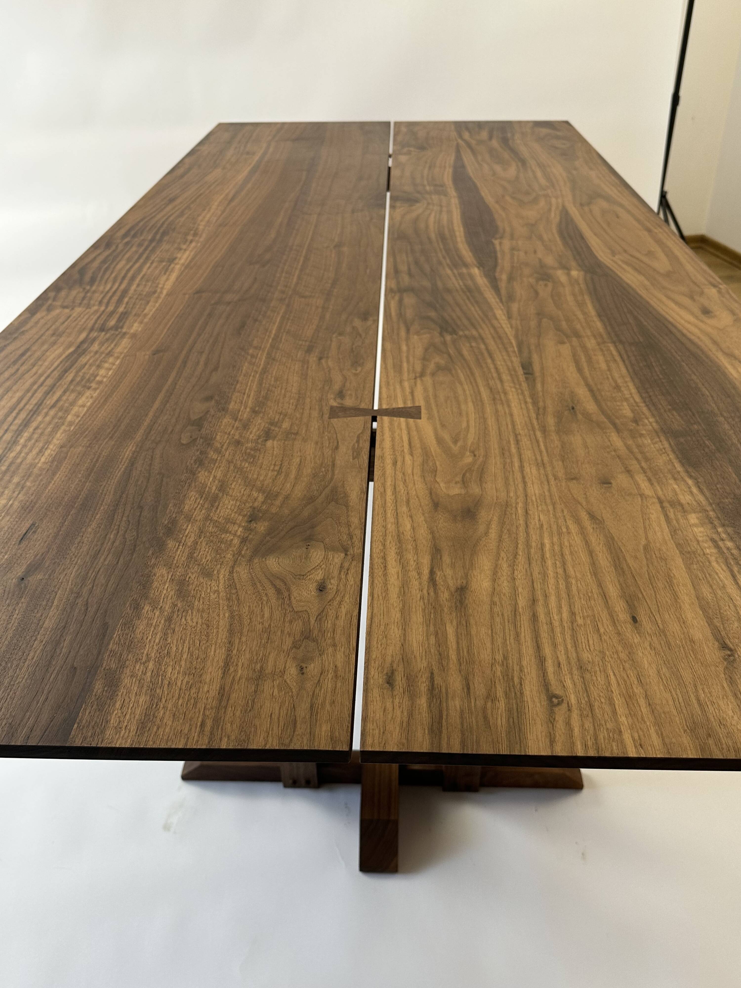 Exceptional dining table in solid walnut.