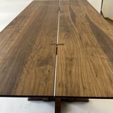 Exceptional dining table in solid walnut.