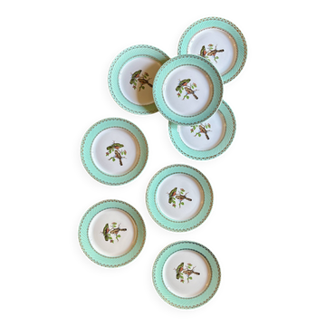 Set of 8 vintage dessert plates with bird designs.