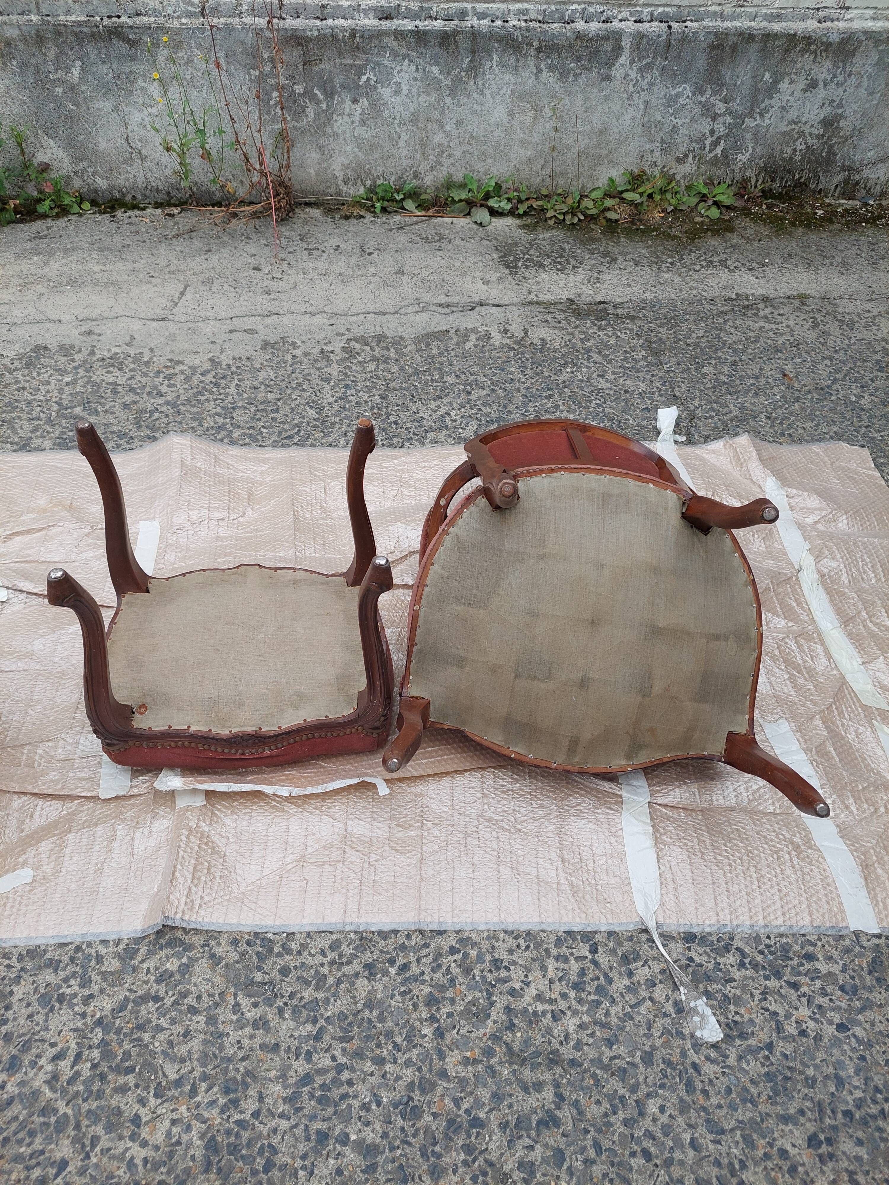 Pair of armchairs with Louis Philippe style footrests in walnut