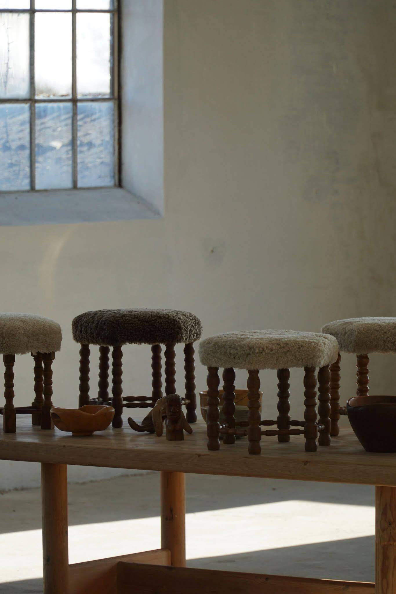 A hexagonal oak stool, seat refurbished in lambswool, Danish design from the 1950s.