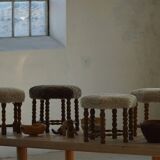 A hexagonal oak stool, seat refurbished in lambswool, Danish design from the 1950s.