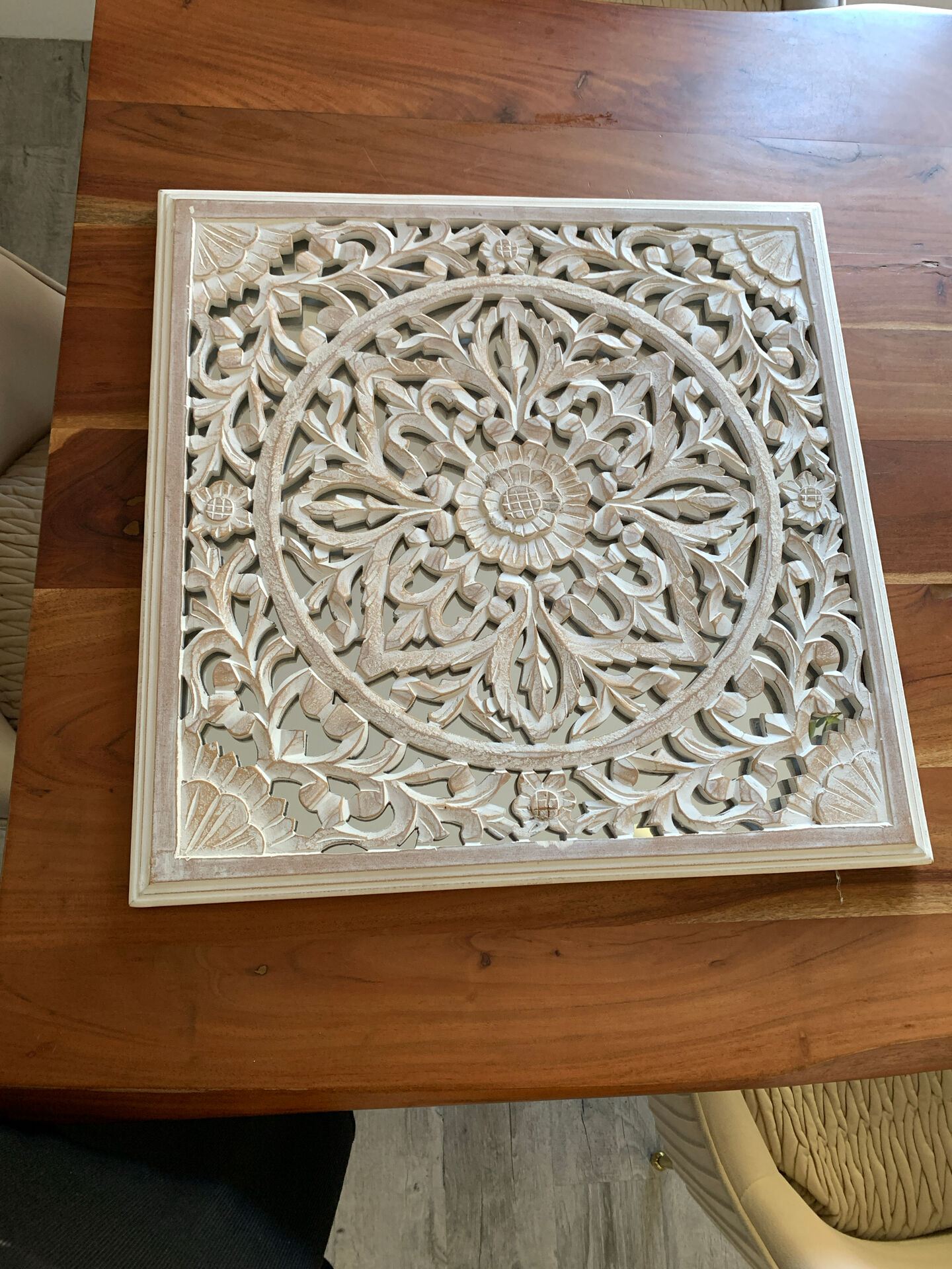 Magnificent carved frame with an interior mirror made of mango wood.