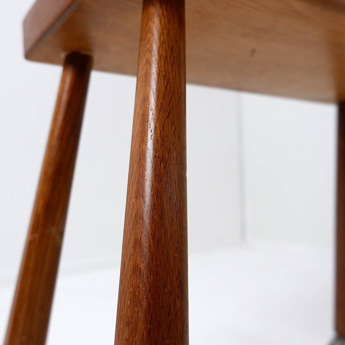 Vintage solid wood side table on casters
