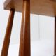 Vintage solid wood side table on casters