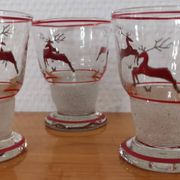 Glasses and carafe decorated with red Christmas reindeer and white granita 60's