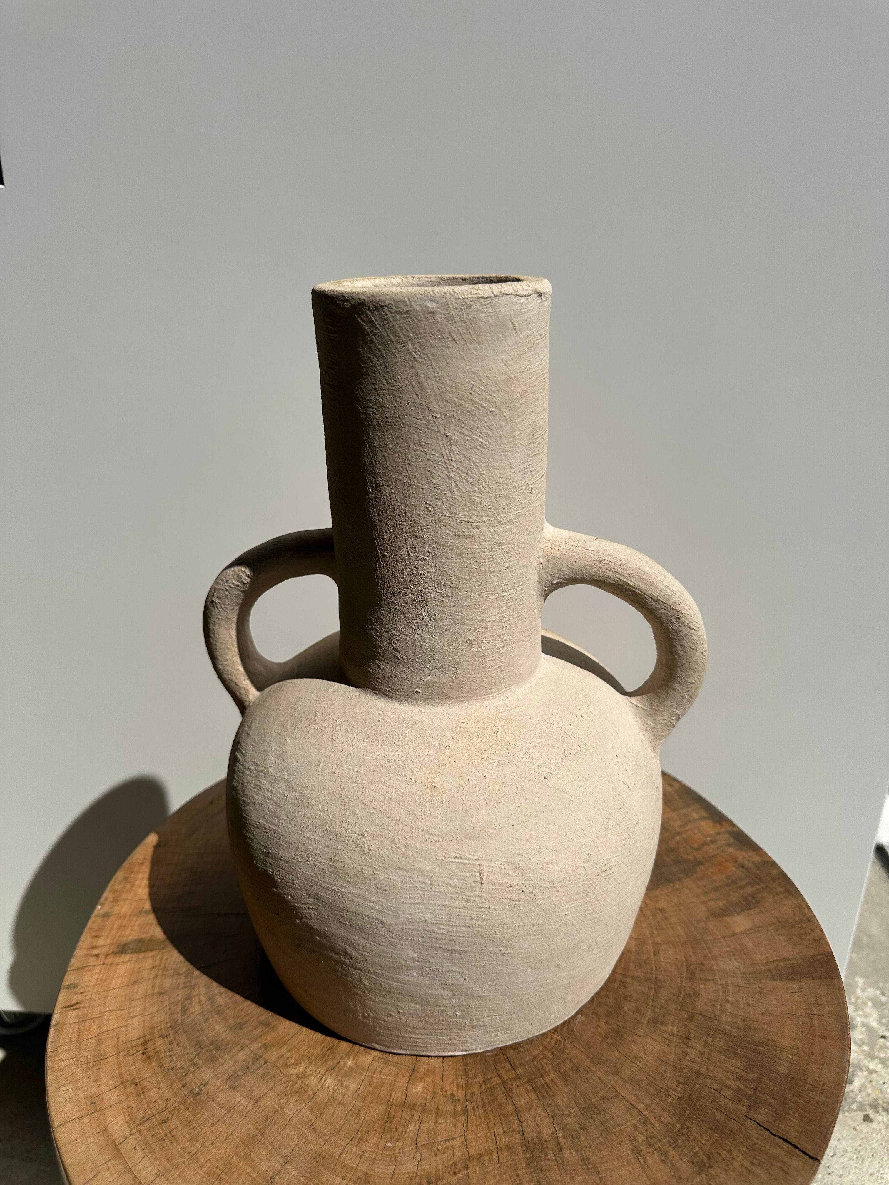 Handmade terracotta vase painted in beige with double handles h:32 d:25