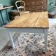 Coffee table with sandblasted top and painted legs.
