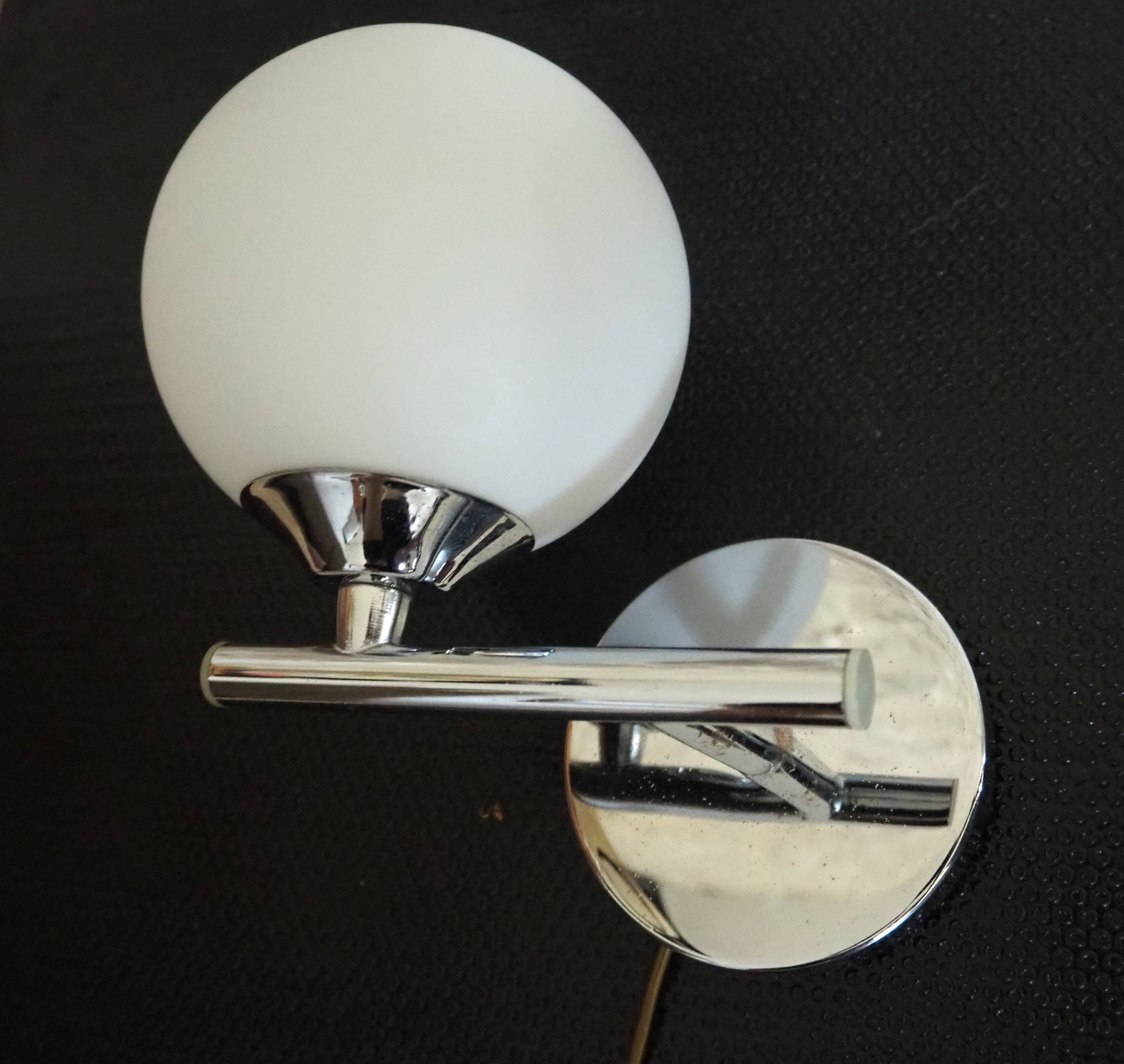 Pair of sconces with an opaline globe and chrome structure from the 1970s