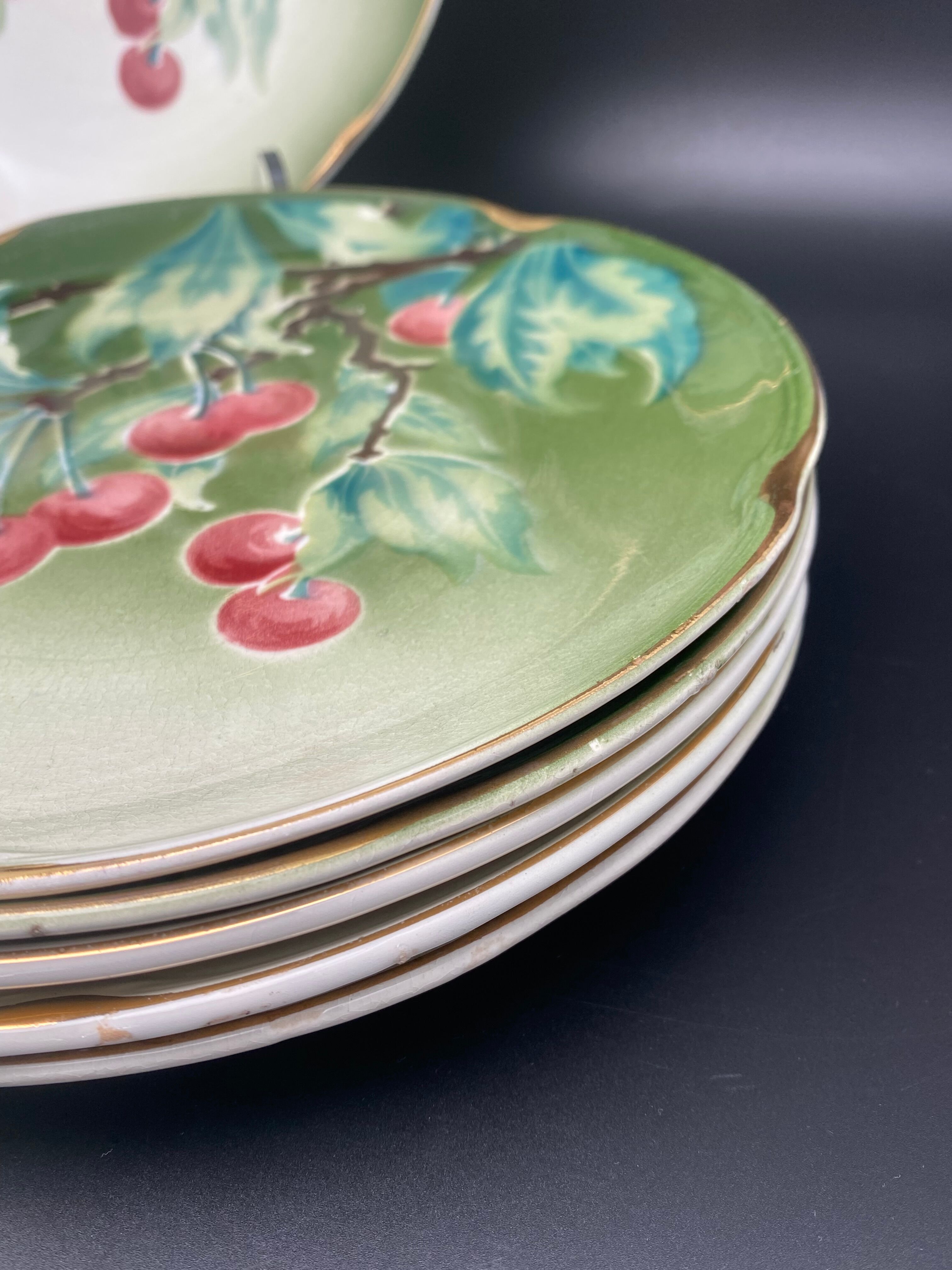 Lunéville cherry plates with golden edges
