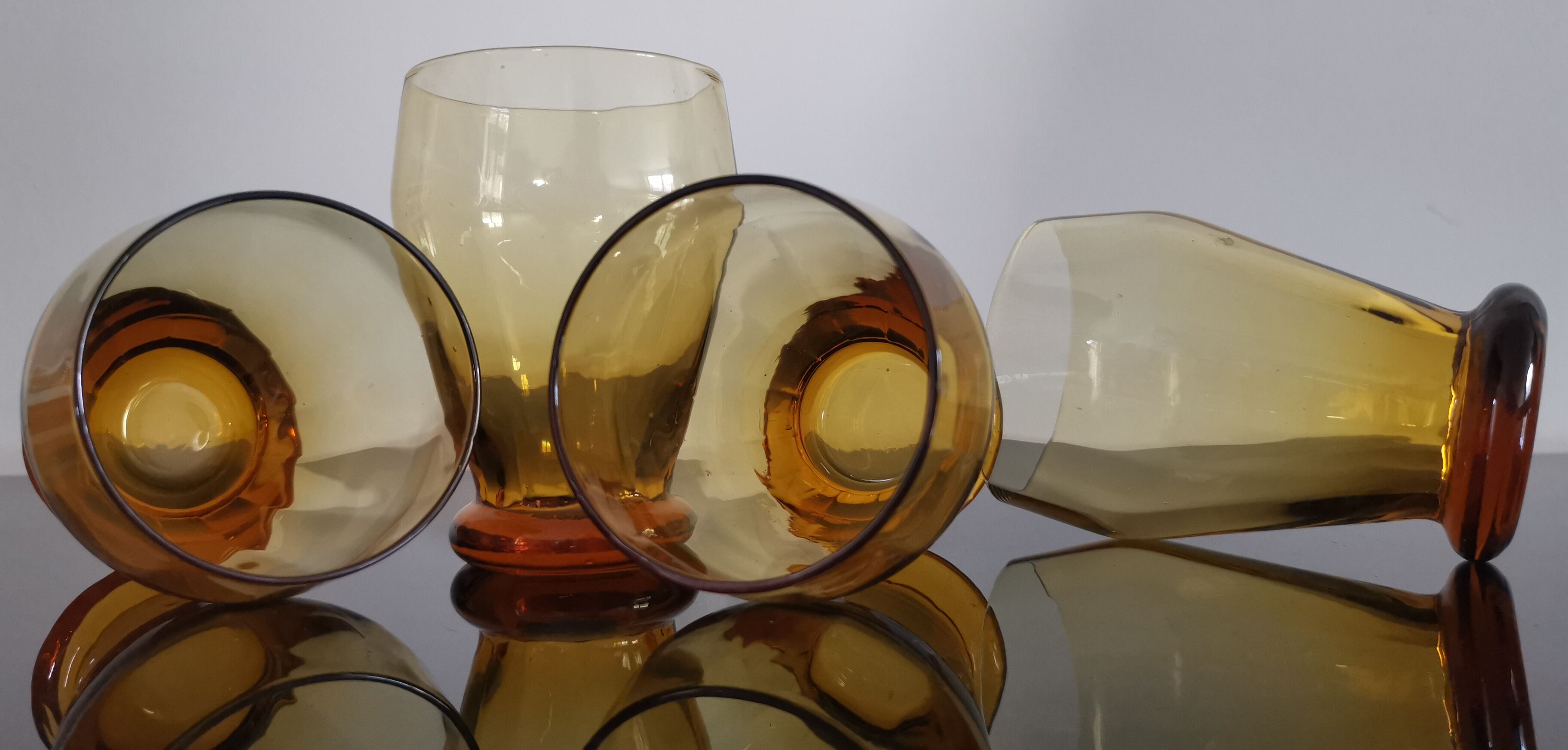 4 old amber colored glasses