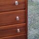 Vintage golden oak chest of drawers with 4 spindle feet from the 1950s