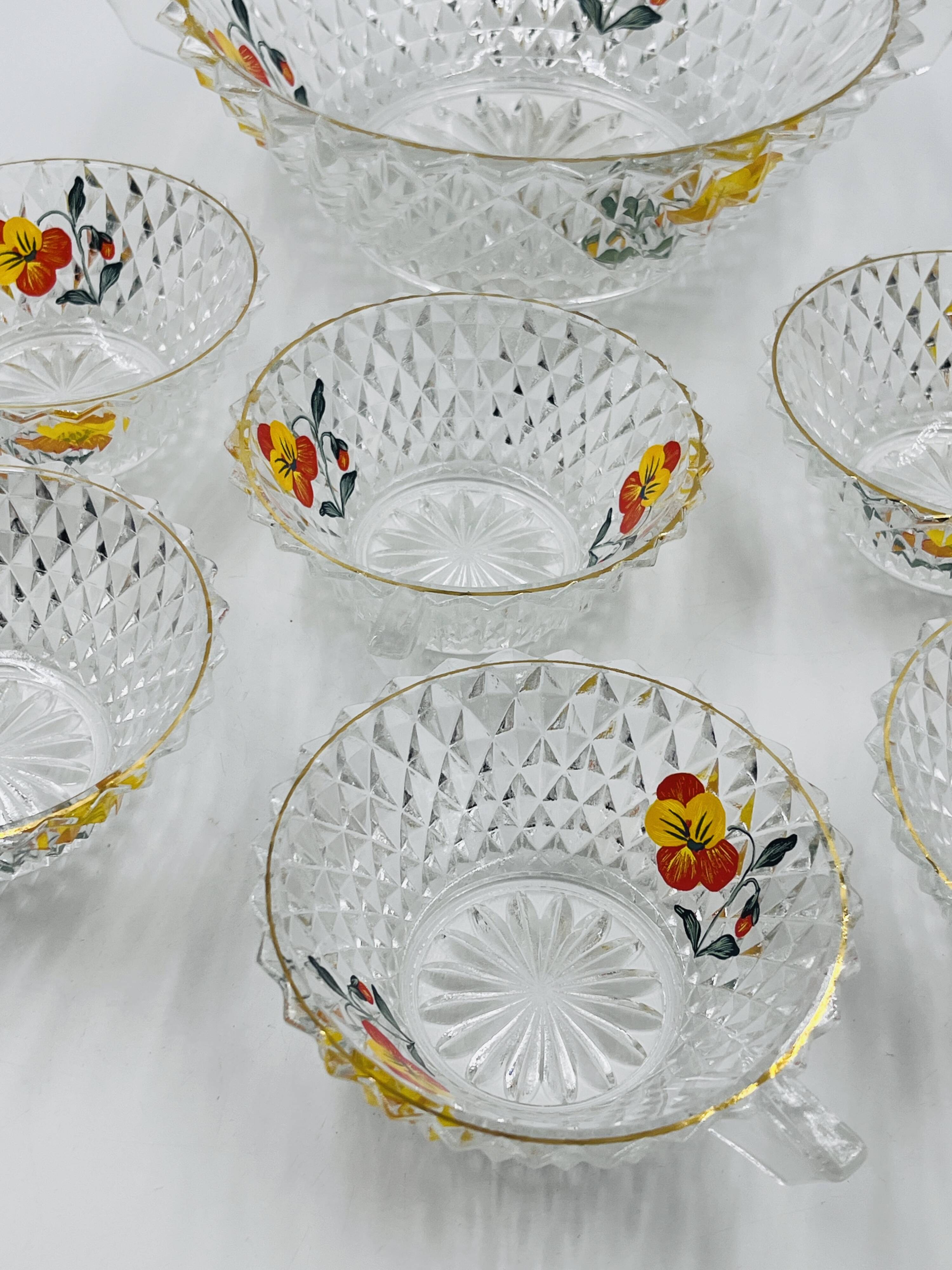 Vintage glass fruit salad serving set with a pansy design.