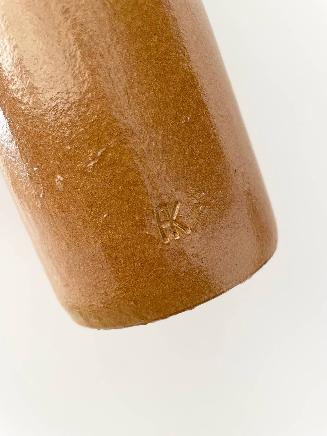 Old stoneware bottle with logo