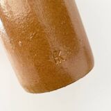 Old stoneware bottle with logo