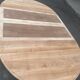Round dining table with a central pedestal, extendable, stripped in solid walnut with 2 extensions.