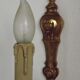 Simple wall sconce in classic Empire style in vintage French bronze.
