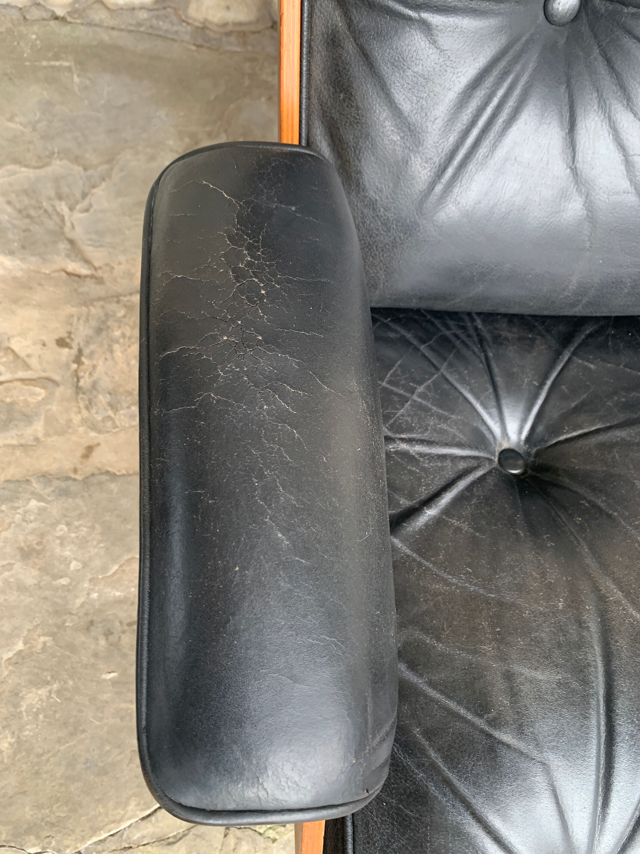 Lounge chair and ottoman black leather and teak multiplex, 1960