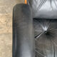 Lounge chair and ottoman black leather and teak multiplex, 1960