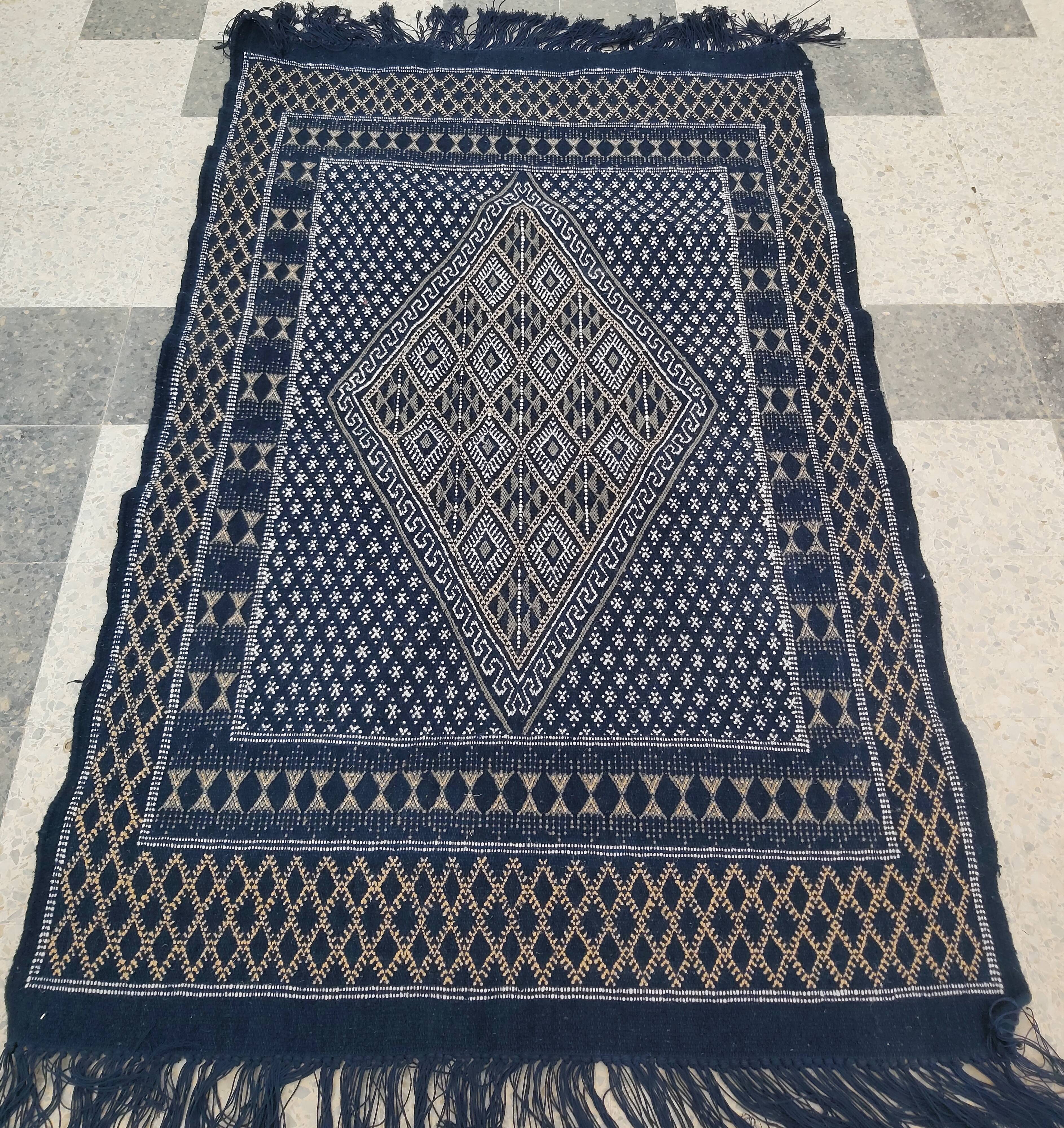 Hand-woven blue carpet in pure wool