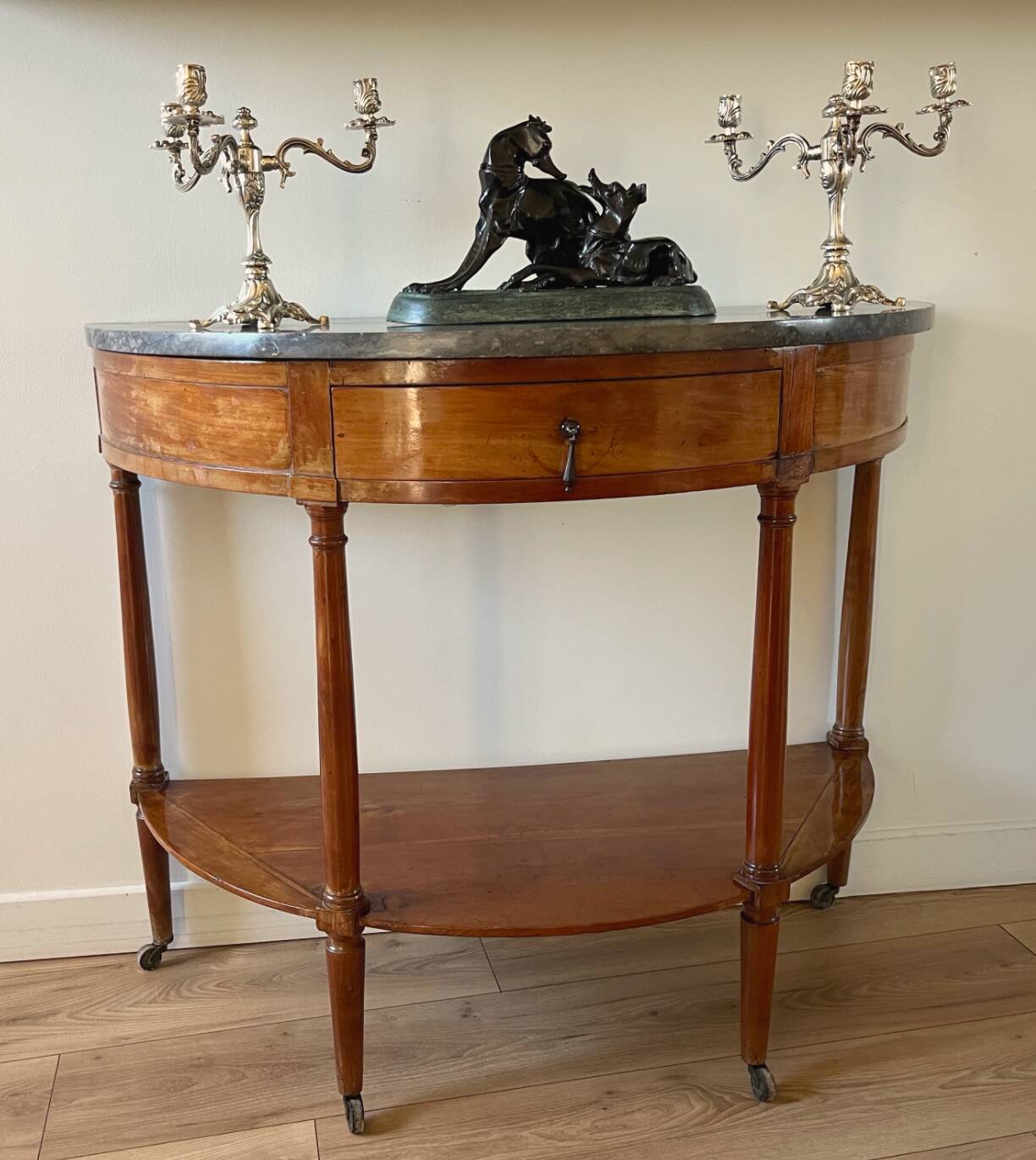 Half-moon console in mahogany with a marble top in Louis XVI style.