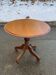 Round side table with a central solid wood leg from the 20th century.