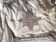 Grey silk nape and towels embroidered with coloured cashmere patterns