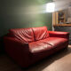 Red leather 2/3-seater sofa by Roche Bobois