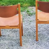 Pair of brutalist chairs in elm and stretched leather with saddle stitching Self publisher