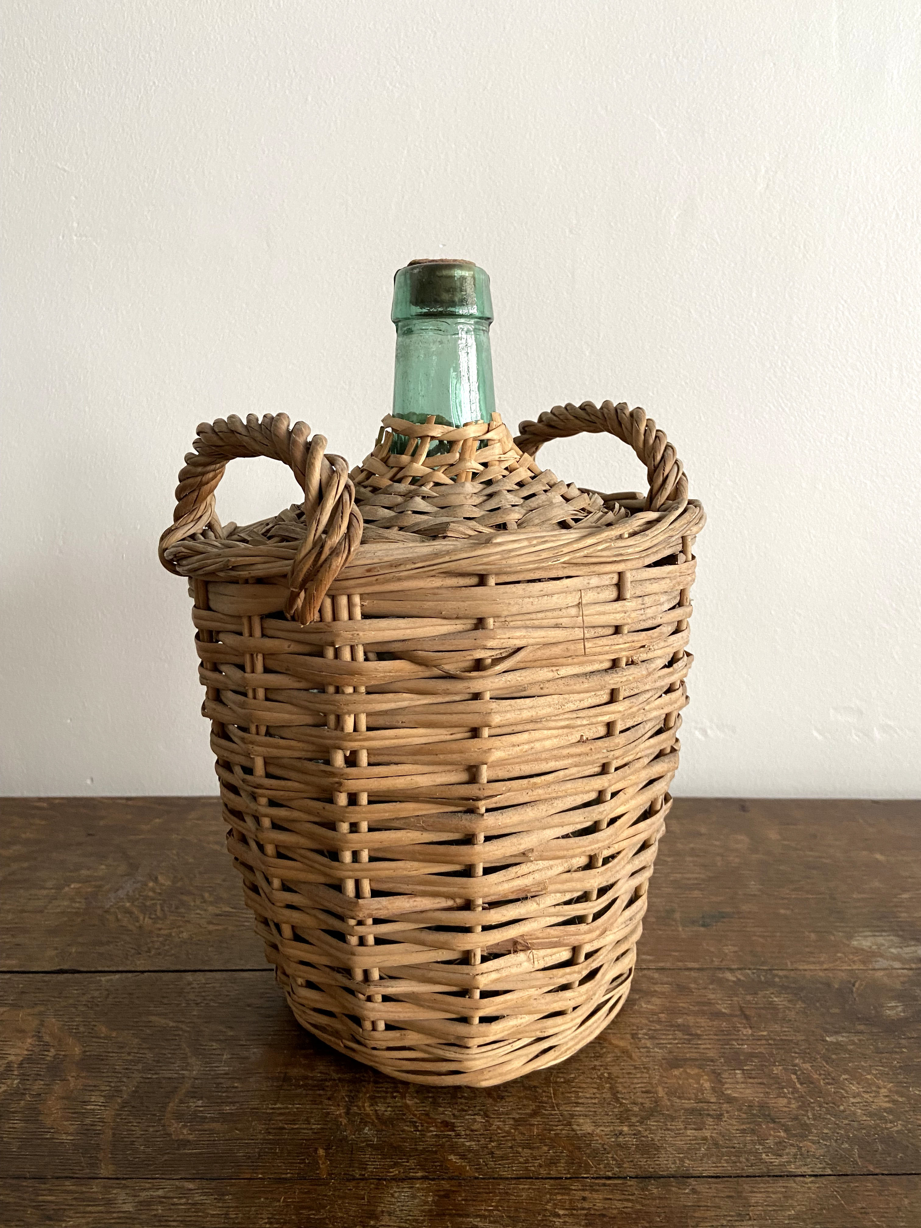 Demijohn surrounded by wicker