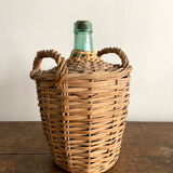 Demijohn surrounded by wicker