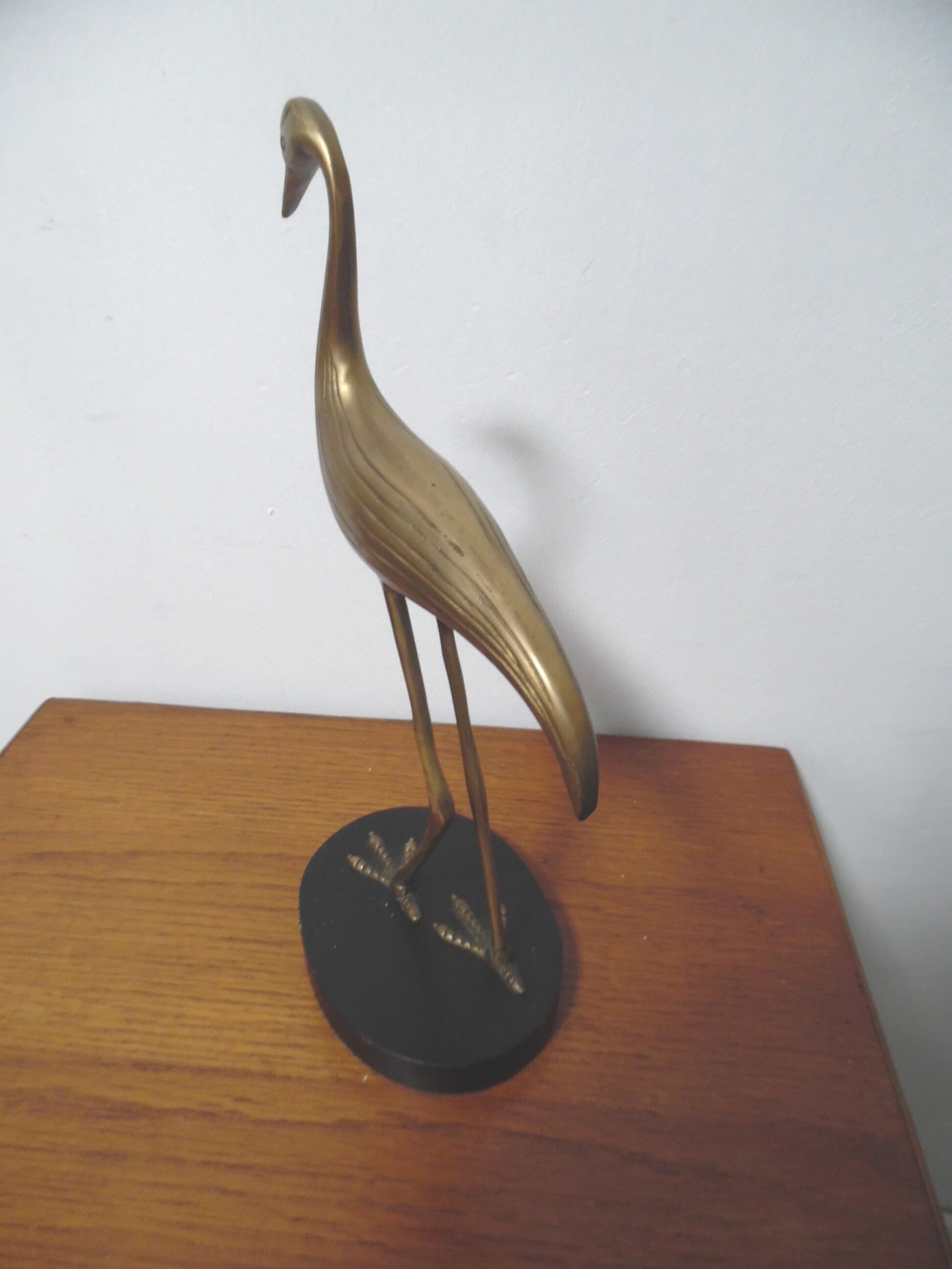 Brass heron standing