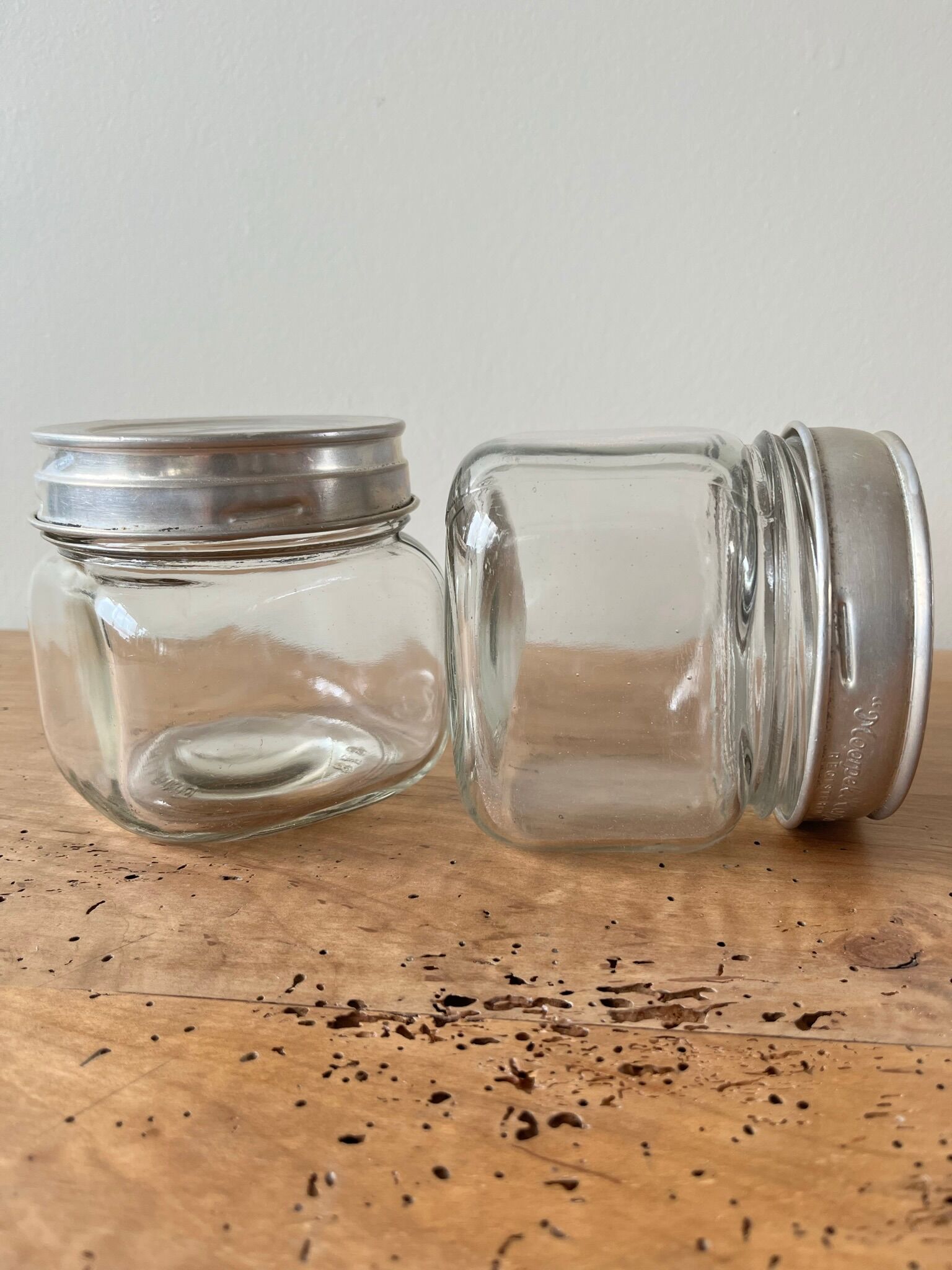 Set of 2 antique jars with aluminum lids